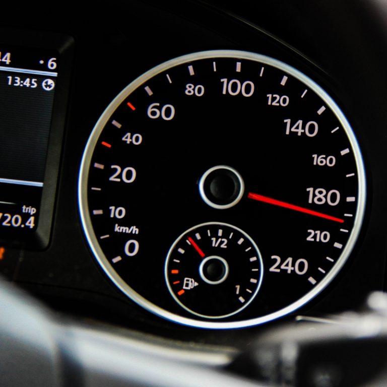 a close up of a speedometer in a vehicle symbolizing the speed of services