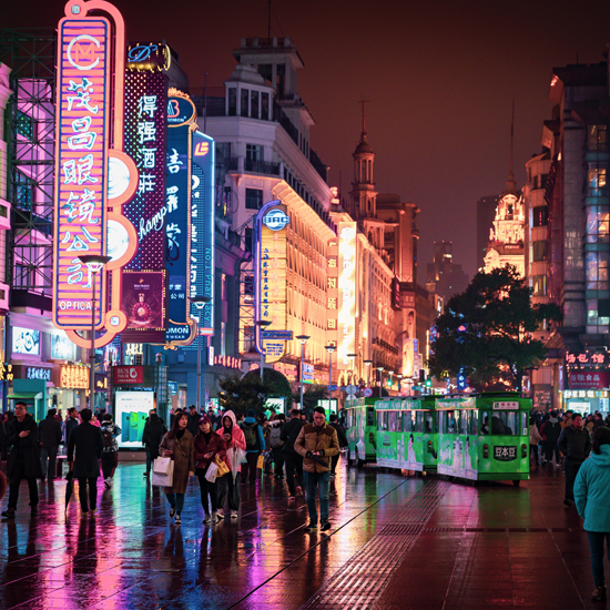 street in china with chinese script neon lights