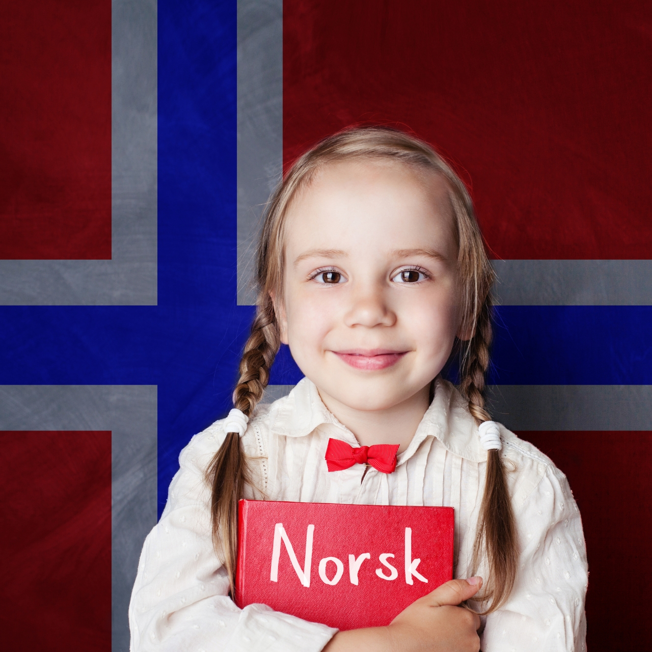 girl holding red book with norsk title against a norwegian flag
