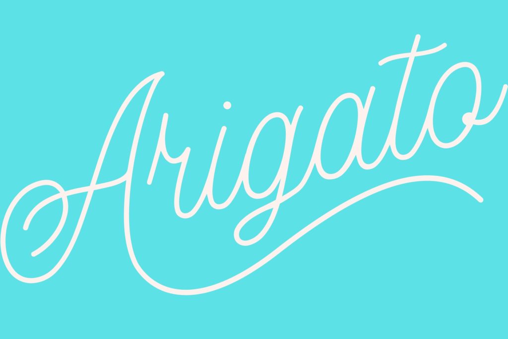 Arigato (Japanese for Thank You) against light blue background