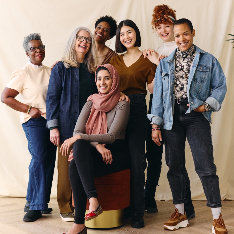 Portrait of mixed age range multi ethnic women smiling. Symoblizes diversity inclusion and minority representation